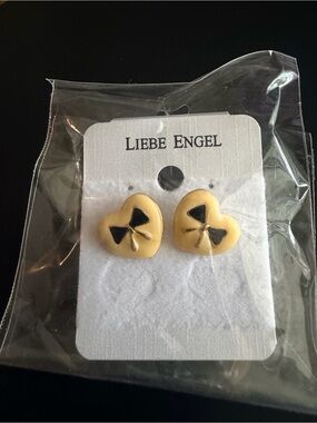 Light Yellow Enamel Heart Stud Earrings with Black Bow Accent